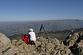 Hiker and tripod at Mission Peak summit