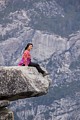 Tourist on Overhanging Rock